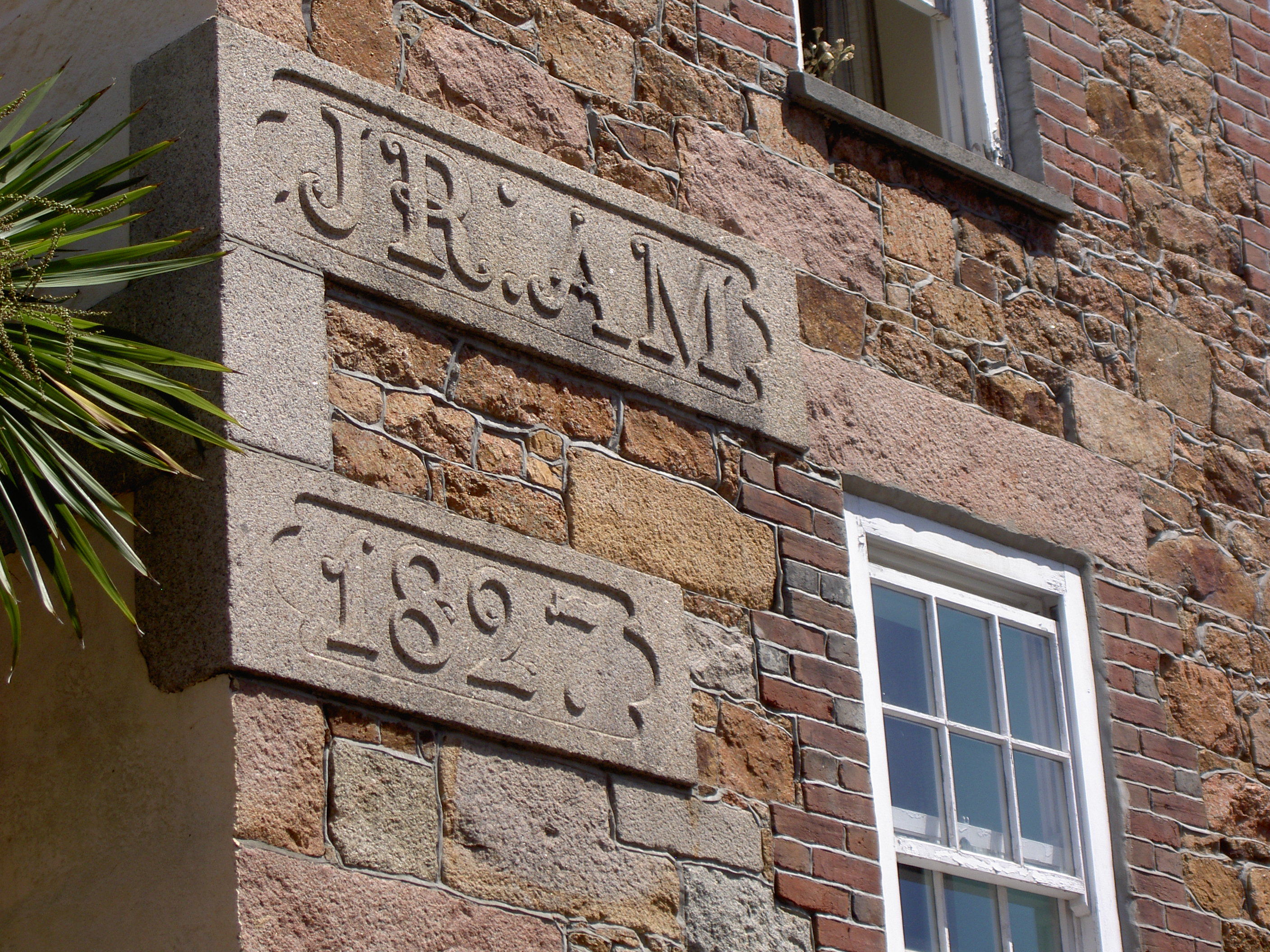 A granite house date stone